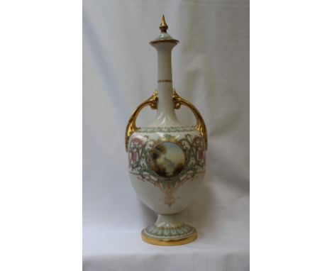 A Royal Worcester single stem twin handled vase and cover, decorated with scrolling leaves, with a roundel painted with a cas