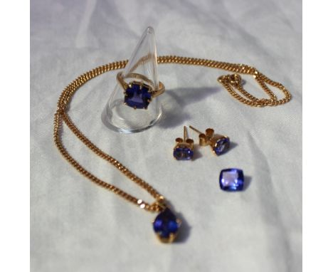 A suite of modern tanzanite jewellery comprising a single stone ring set with a square cushion shaped mixed cut tanzanite, a 