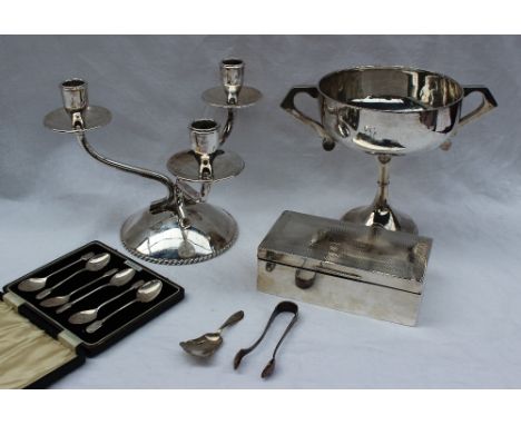 A George V silver twin handled trophy cup, Birmingham, 1922 together with a white metal three branch candleabra marked 925 St