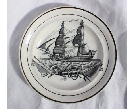 A Swansea Pottery plate with monochrome decoration of a ship in full sail with cannon, swords, trident etc. in the foreground