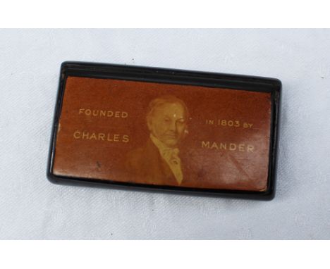 A papier mache snuff box advertising"Founded in 1803 by Charles Mander", the interior of the lid print "Mander Brothers, Varn