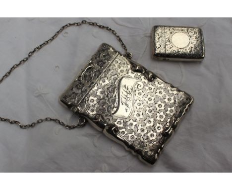 An Edward VII silver carrying card case decorated with flowerheads, Sheffield, 1902, Walker & Hall, together with a silver ve