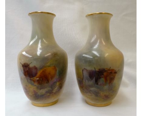 A pair of Royal Worcester porcelain vases of baluster form painted with highland cattle in a naturalistic setting, signed H S