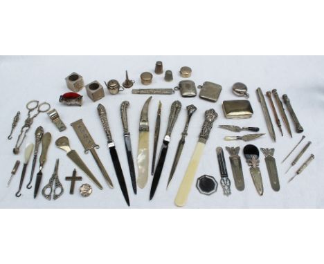 A silver ball point pen together with silver handled paper knives, silver book marks, silver sugar nips, cross, buttons, silv