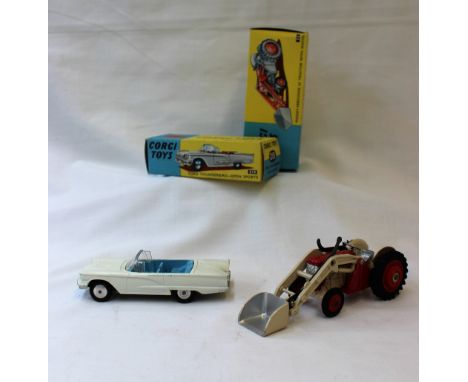 A Ford Thunderbird open sports car No.215 together with a Massey-Ferguson 65 tractor with shovel No.53, both boxed