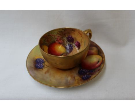 A Royal Worcester cabinet coffee cup and saucer, the cup painted with apples and blackberries in a naturalistic setting, sign