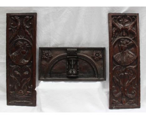 A pair of 18th century carved oak panels, depicting scrolls and portrait heads, 17 x 50.5cm together with another carved oak 