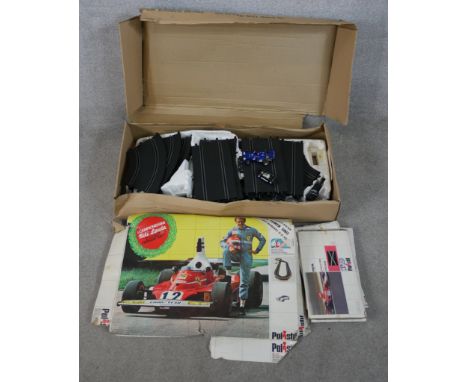 A mid 20th century boxed Scalextric Postril car racing set complete with instruction manual.W.100 D.50cm 