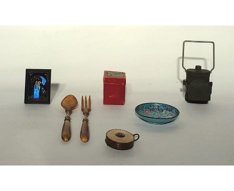 A cloisonee dish, a gyroscope top, three carved cowrie shells depicting birds and animals, pair of horn salad servers, bicycl