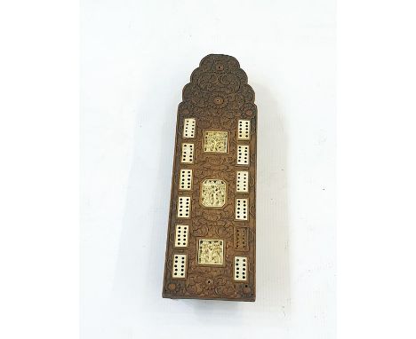 An Anglo-Indian carved wood cribbage board&nbsp;inlaid with bone panels carved with figures, mounted on a carved wooden stand