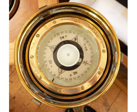 A ship's brass binnacle with gimbal compass, the removal pot with light the compass inscribed "PATT 183 number 65...H R/81/SI