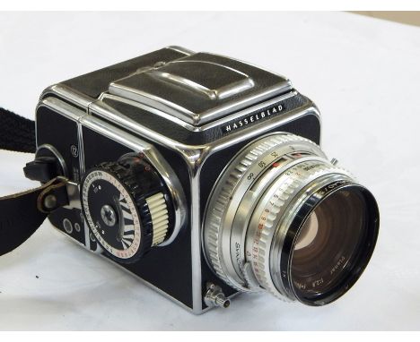 Hasselblad 500C camera with HASSELBLAD Plainar 1:28 lens, a Hasselblad Film Magazine A12 (boxed), another Film Magazine, a Ha