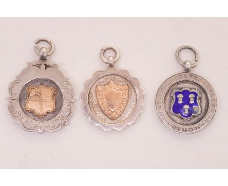 Three early 20th Century Football medals to include:

1. George V silver with central gilt shield football medal Altringham &