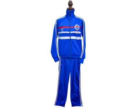 An Adidas blue and white BRIGHTON &amp; HOVE ALBION 1983 FA Cup Final v Manchester tracksuit and bottoms, the top with zip up