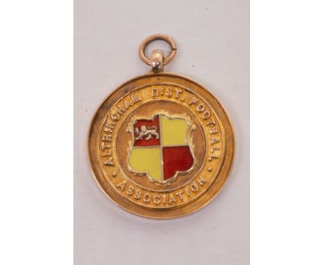 A George V 9ct gold and enamel Altrincham and District Association Junior Cup 1921 Football medal, engraved presentation insc