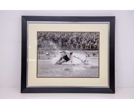 Sir Tom Finney:&nbsp;&nbsp;This is a print of the iconic image aqua-planing at Stamford bridge in 1956 playing for Preston No