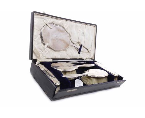 GEORGE V SILVER VANITY SETmaker Charles Henry Dumenil, London 1919, comprising two brushes, two clothes brushes, hand mirror 