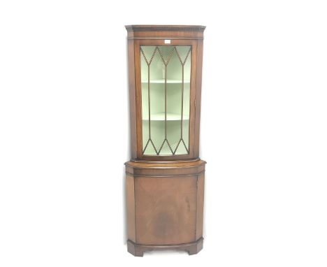 20th century mahogany corner display cabinet,  projecting cornice, dentil frieze, single glazed door enclosing two shelves, a