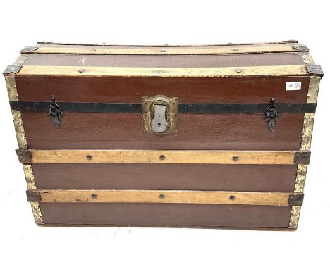 Wood bound dome top travelling trunk, single hinged lid Dimensions: Height:&nbsp;57cm&nbsp; Length/Width:&nbsp;85cm&nbsp; Dep