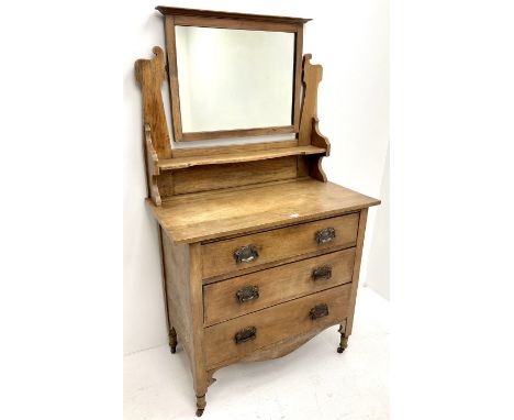 Art Nouveau oak three drawer dressing chest, raised mirror back, single shelf, three graduating drawers, shaped apron, stile 