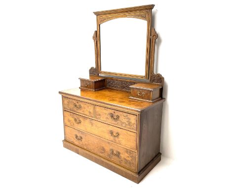 Edwardian walnut dressing chest, raised swing mirror back, two trinket drawers above two short and two long drawers, platform