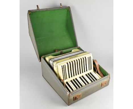 A Cased Hohner Student III Accordion