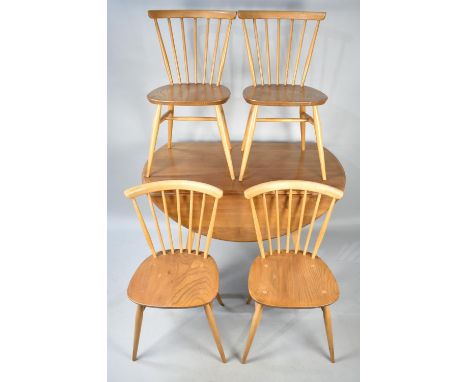 An Ercol Drop Leaf Dining Table and Four Spindle Back Chairs