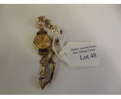 Tissot lady's wrist watch with 9ct gold bracelet.