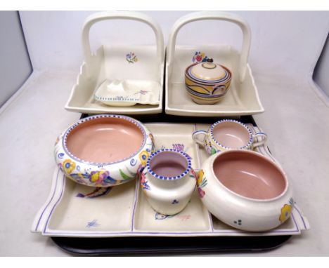 A tray of nine pieces of Poole pottery.