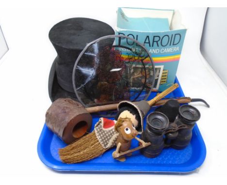A tray containing antique field glasses, top hat, Polaroid camera, rustic pipe etc.