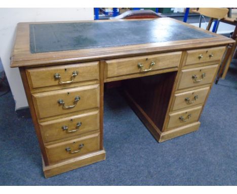 A 19th century mahogany twin pedestal writing desk with a green leather inset panel, 75cm by 125cm by 66cm. 