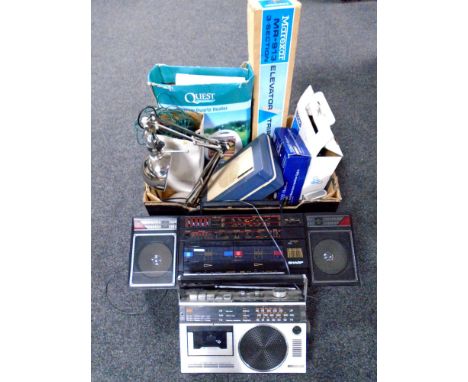 A box containing electricals including Christmas lights, a music maker, portable record player, angle poise lamp, heater, cam