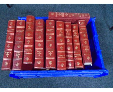 A crate containing Encyclopedia Britannica volumes.