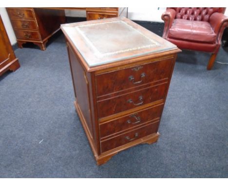 A yew wood two drawer filing chest with a brown leather inset panel.