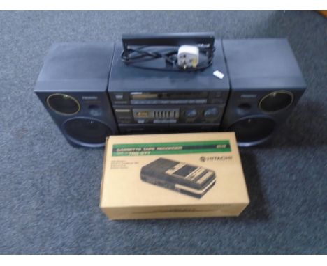 A Panasonic S-XBS music system together with a boxed Hitachi cassette tape record.