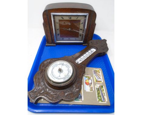 A tray containing aneroid barometer, Smiths Sectric oak cased mantel clock together with a set of cigarette cards.