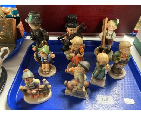 A tray of nine Goebel figures of girls and boys.