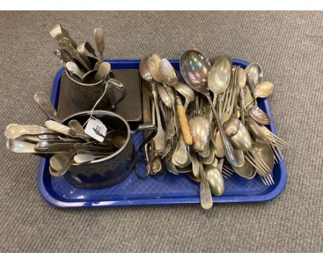 A quantity of antique and later cutlery, silver plated jug and sugar basin, cased spoons etc.