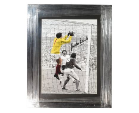 Football Memorabilia - A signed picture of England goalkeeper Gordon Banks (1937 - 2019) in the England V Germany match durin