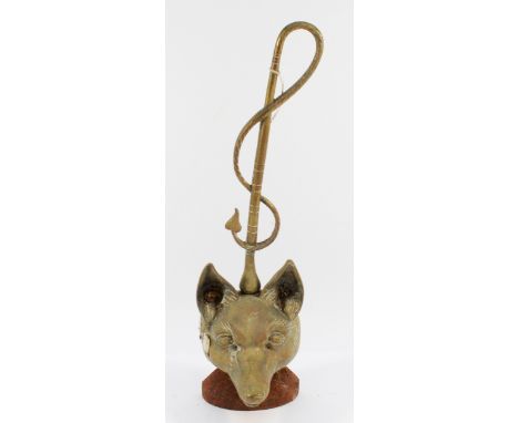 A brass doorstop depicting a fox head and whip, on a stone base, H-44cm.