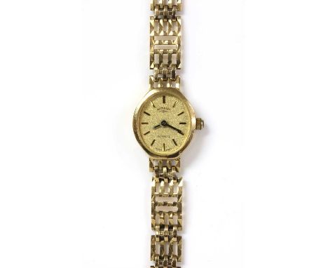 A ladies' 9ct gold Rotary quartz bracelet watch, with baton hour markers and gilt hands, to integral bracelet and ladder snap
