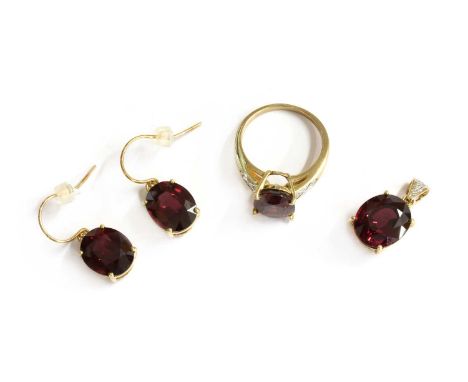 A 9ct gold garnet and diamond ring, pendant and earrings suite, the earrings with hook fittings and rubber stoppers, all hall