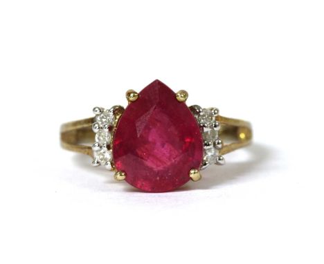 A 9ct gold fracture filled ruby and diamond ring, with a pear mixed cut fracture filled ruby, approximately 11 x 9mm, claw se