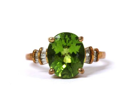 A 9ct gold peridot and diamond ring, with an oval mixed cut peridot, approximately 12 x 10mm, claw set, with two rows of bagu