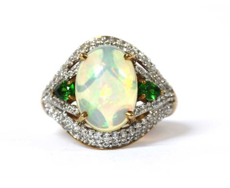 A 9ct gold opal, chrome diopside and zircon ring, with an oval cabochon opal, approximately 14 x 10mm, with a pear mixed cut 