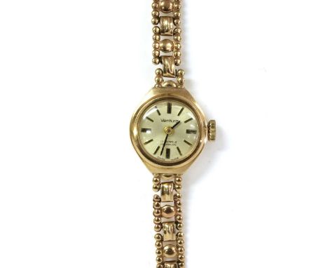 A ladies' 9ct gold Ventura mechanical bracelet watch, with a silvered dial, to integral link bracelet and ladder snap clasp, 