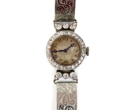 An Art Deco ladies' diamond set mechanical cocktail watch, c.1925, with a 20mm case with silvered dial, black Arabic numerals