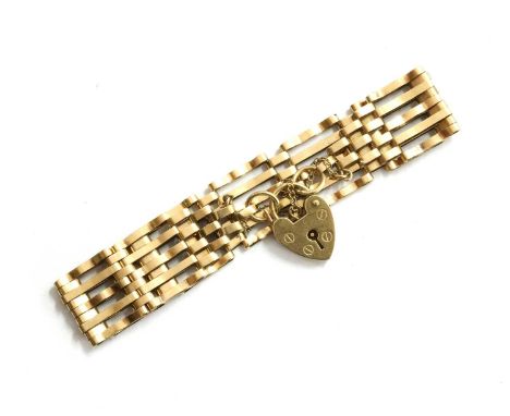 A 9ct gold gate bracelet, with heart shaped padlock clasp and safety chain, London 1976, 10.55gCondition report: Surface mark