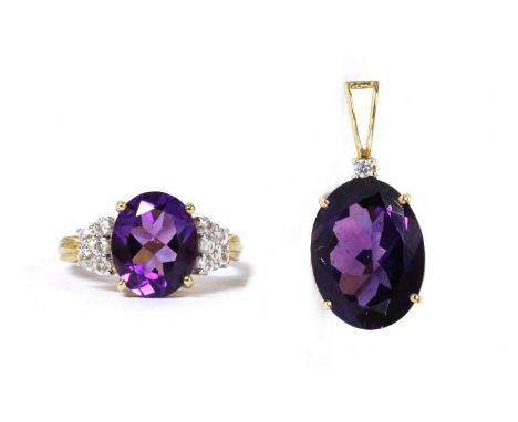 A 14ct gold amethyst and diamond pendant, with an oval mixed cut amethyst, approximately 16 x 12mm, surmounted by a brilliant