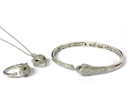 A silver chrome diopside and diamond set panther bangle, pendant and ring suite, the panthers with chrome diopside set eyes a